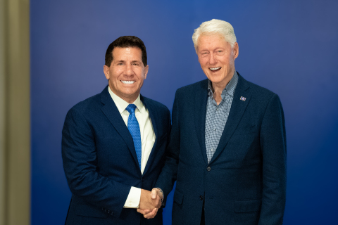 John with President Bill Clinton